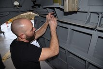 (03/06/2018) -- Museum restoration specialist Chase Meredith attaches bomb bay doors of the Boeing B-17F Memphis Belle. Plans call for the aircraft to be placed on permanent public display in the WWII Gallery here at the National Museum of the U.S. Air Force on May 17, 2018. (U.S. Air Force photo by Ken LaRock)