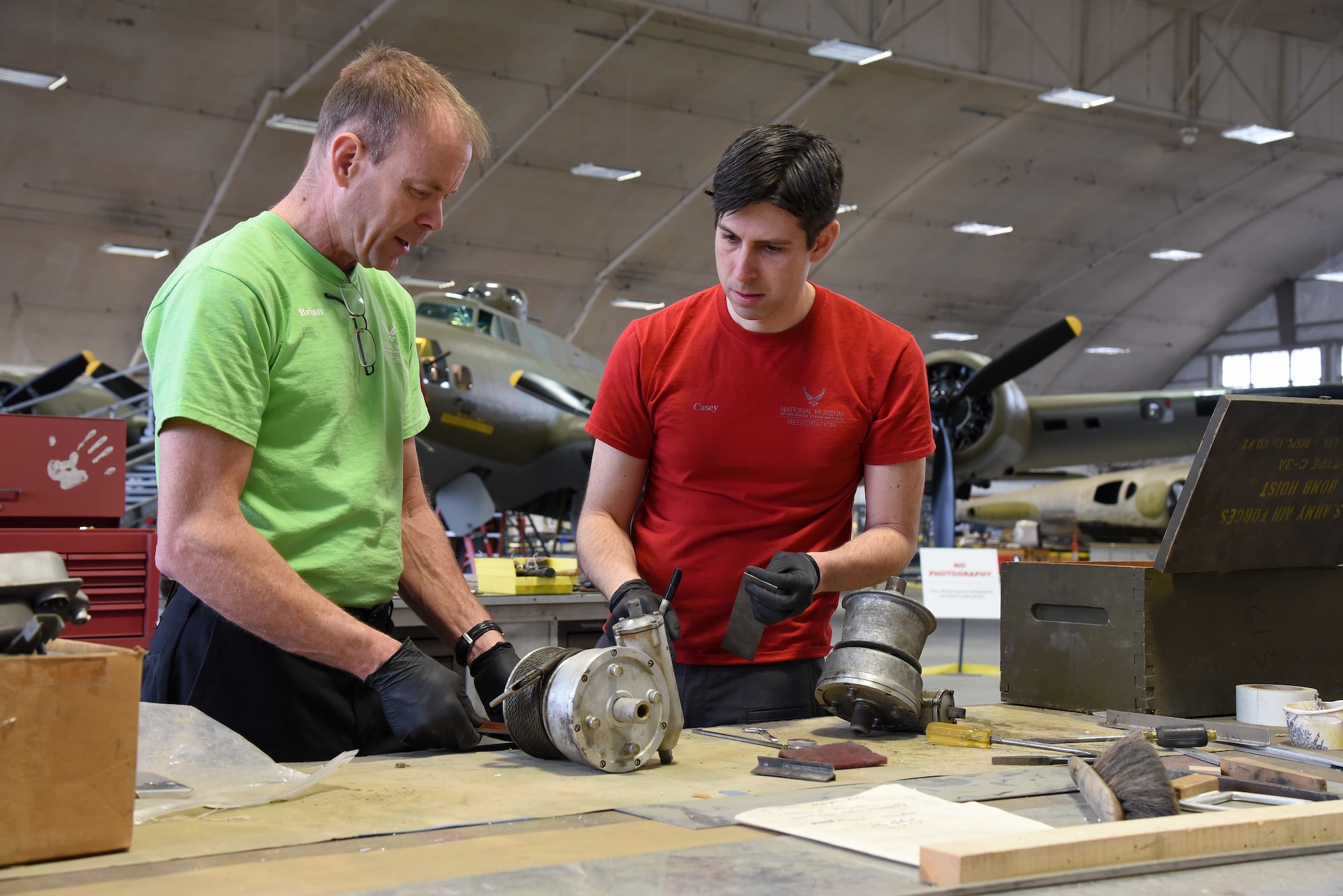 (03/07/2018) -- Museum restoration specialists Brian Lindamood and Casey Simmons working on bomb bay parts for the Boeing B-17F Memphis Belle. Plans call for the aircraft to be placed on permanent public display in the WWII Gallery here at the National Museum of the U.S. Air Force on May 17, 2018. (U.S. Air Force photo by Ken LaRock)