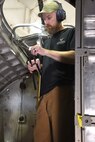 (03/07/2018) -- Museum restoration specialist Chad Vanhook works in the radio room of the Boeing B-17F Memphis Belle. Plans call for the aircraft to be placed on permanent public display in the WWII Gallery here at the National Museum of the U.S. Air Force on May 17, 2018. (U.S. Air Force photo by Ken LaRock)