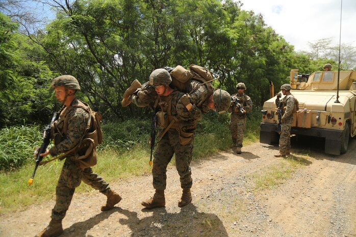 U.S. Marine Corps Pfc. Sam Lamonda fireman carries a simulated casualty during a combined anti-armor team mounted patrol training event during Exercise Bougainville I at Marines Corps Training Area Bellows, March 15, 2018. Throughout the CAAT training, the Marines had to react to simulated improvised explosive devices and ambushes. Exercise Bougainville I is used to train U.S. Marines to fight at the small-unit level and build their proficiency for future deployments. Lamonda, a native of Columbus, Ohio, is with Weapons Company, 1st Battalion, 3d Marine Regiment. He graduated from Worthington Kilbourne High School.