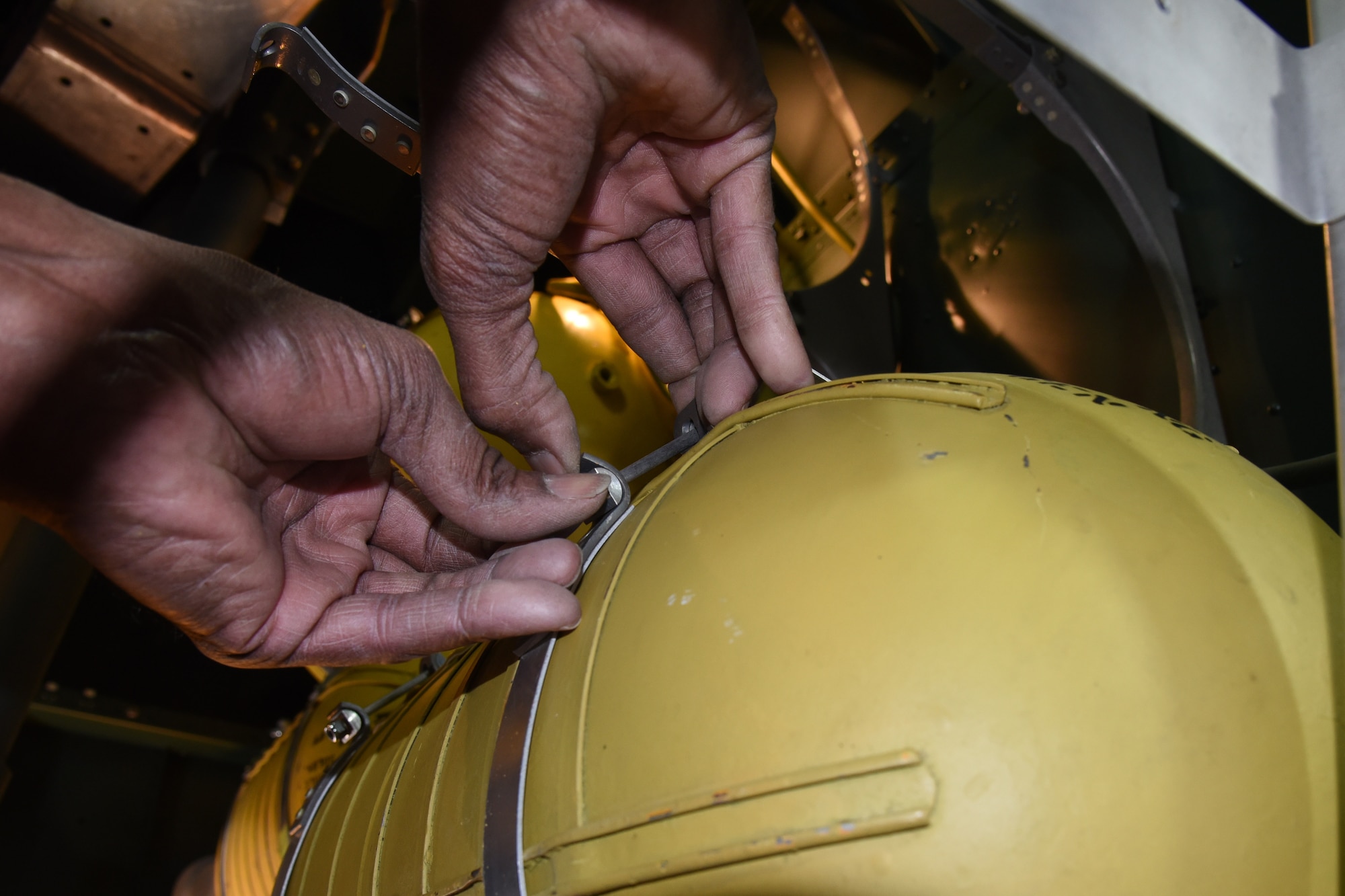 (03/09/2018) -- Museum restoration specialist Dave Robb works on an oxygen tank in the Boeing B-17F Memphis Belle. Plans call for the aircraft to be placed on permanent public display in the WWII Gallery here at the National Museum of the U.S. Air Force on May 17, 2018. (U.S. Air Force photo by Ken LaRock)