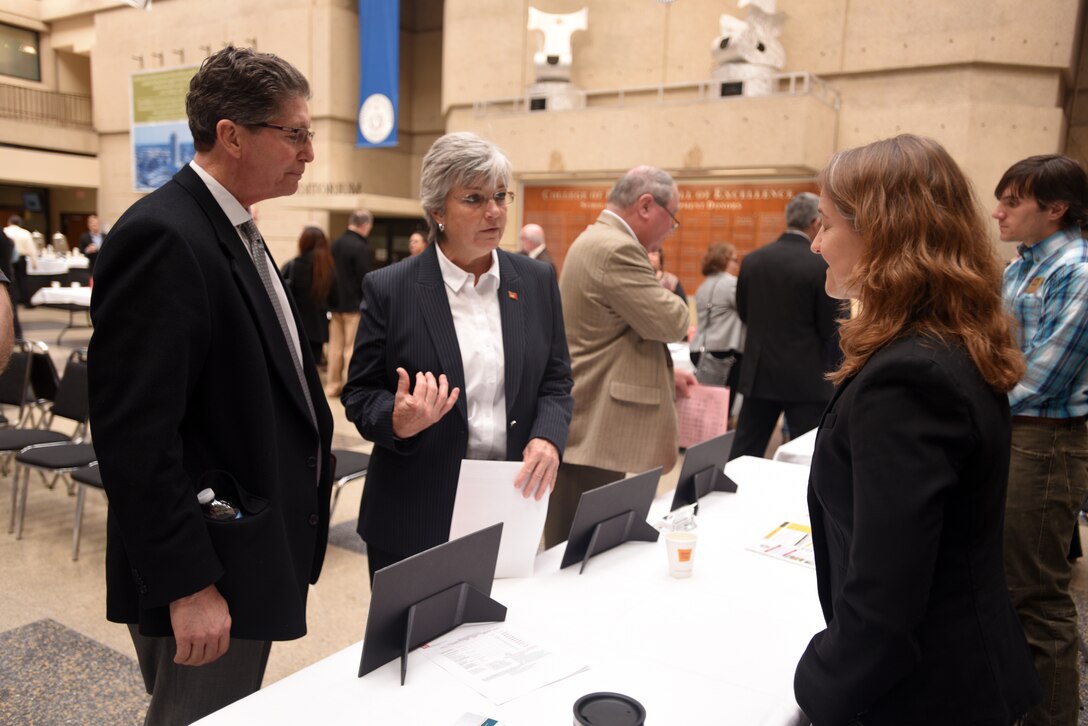 Patty Coffey (Center), U.S. Army Corps of Engineers Nashville District deputy district engineer, and Joanne Traicoff, Nashville District Construction and Engineering Division deputy chief, provide information to Marc J. Norris, Pro2Serve vice president and Business Development director, during the Business Opportunities Open House, also known as "BOOH," at Tennessee State University in Nashville, Tenn., March 15, 2018. (USACE photo by Lee Roberts)