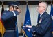 U.S. Air Force Brig. Gen. Thomas L. Ayers, U.S. Air Forces in Europe and U.S. Air Forces Africa mobilization assistant to the Director, Operations, Strategic Deterrence and Nuclear Integration, receives a U.S. flag at his retirement ceremony on Ramstein Air Base, Germany, Mar. 12, 2018. Ayers retired after 32 years of honorable service. (U.S. Air Force photo by Senior Airman Elizabeth Baker)