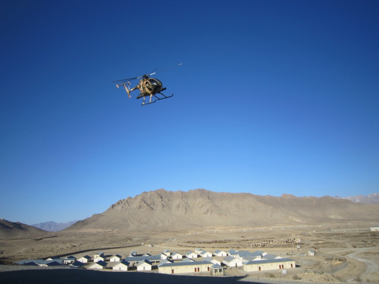 A Special Mission Wing helicopter delivers Crisis Response Unit 222 operators to the target during an exercise at the military training center in Kabul, Afghanistan, Feb. 3, 2018. The exercise tested the ability of the special operators to conduct rapid mission planning and execution in a condensed time period. NATO Special Operations Component Command-Afghanistan photo by Lashawn Sykes