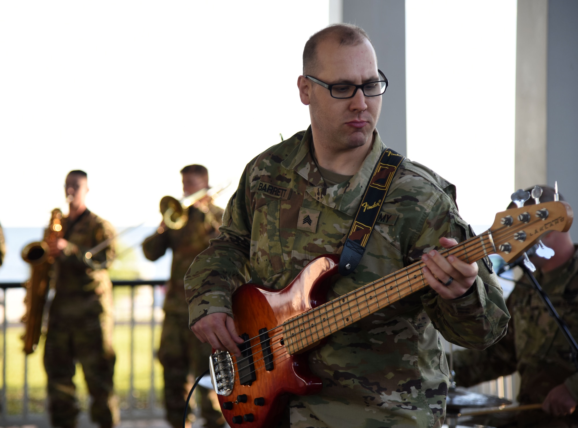 U.S. Army Sergeant Joseph Barrett, U.S. Army 41st Army Band bass guitarist and musical ambassador, Mississippi Air National Guard, Jackson, Mississippi, performs at the Biloxi Lighthouse Park Pavilion March 13, 2018, in Biloxi, Mississippi. The band has been providing musical support and entertainment for over 50 years. They also performed at the White House Hotel, in Biloxi, Mississippi, and at the Vandenberg Commons on Keesler Air Force Base, Mississippi. (U.S. Air Force photo by Kemberly Groue)