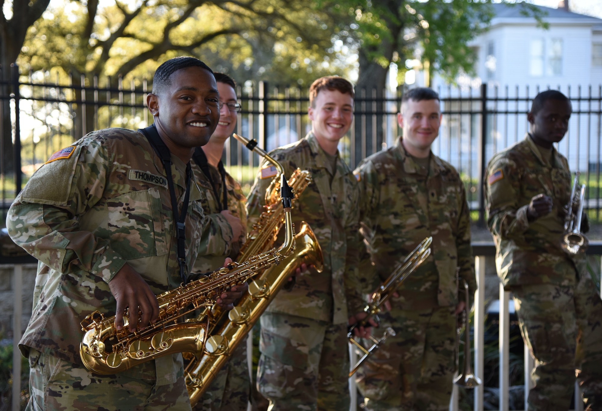 Members of the U.S. Army 41st Army Band, Mississippi Air National Guard, Jackson, Mississippi, pose for a picture at the Biloxi Lighthouse Park Pavilion March 13, 2018, in Biloxi, Mississippi. The band has been providing musical support and entertainment for over 50 years. They also performed at the White House Hotel, in Biloxi, Mississippi, and at the Vandenberg Commons on Keesler Air Force Base, Mississippi. (U.S. Air Force photo by Kemberly Groue)