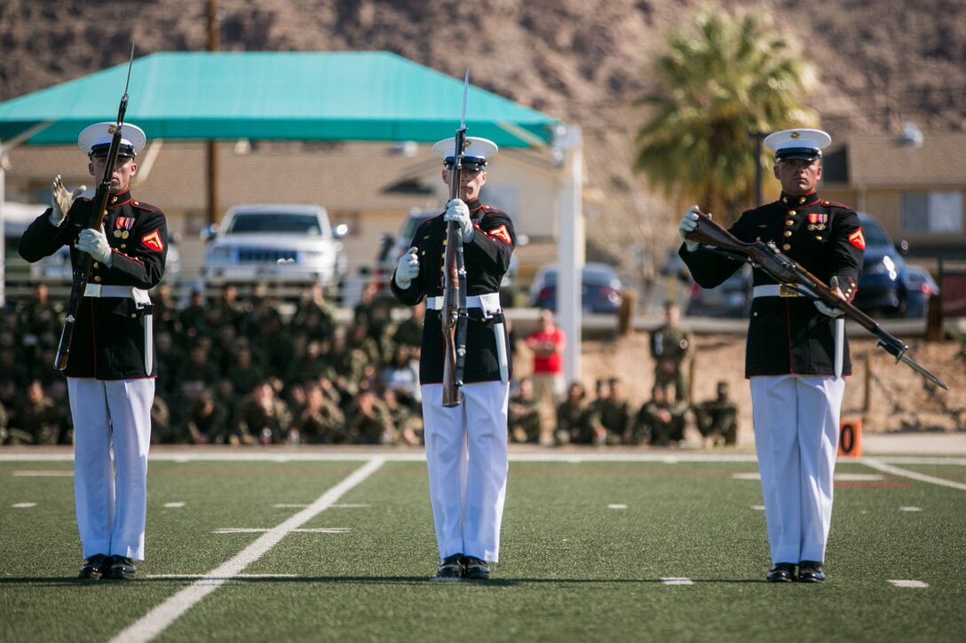 The U.S Marine Corps Silent Drill Platoon, Battle Colors Detachment, Marine Barracks Washington, D.C., performs during the Battle Colors Ceremony at Felix Field aboard the Marine Corps Air Ground Combat Center, Twentynine Palms, Calif., March 14, 2018. The ceremony is held to honor Marine Corps traditions through the Drum Corps, the Silent Drill Platoon and the Battle Colors Detachment.  (U.S. Marine Corps photo by Lance Cpl. Margaret Gale)
