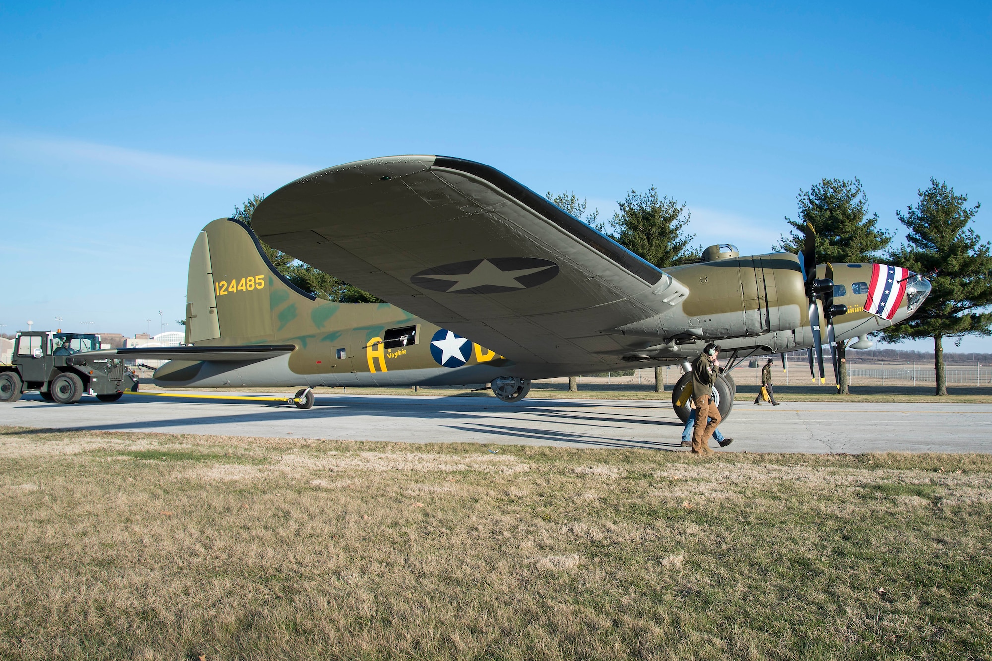 (03/14/2018) -- The B-17F Memphis Belle moves along the tow path toward the WWII Gallery at the National Museum of the United States Air Force on March 14, 2018. Plans call for the aircraft to be placed on permanent public display in the WWII Gallery here at the National Museum of the U.S. Air Force on May 17, 2018. (U.S. Air Force photo by Robert Bardua)