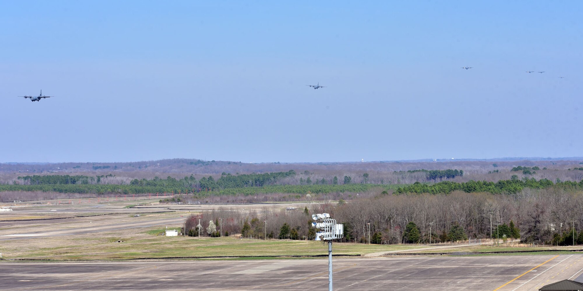 Six C-130J aircraft prepare for landing Mar. 15, 2018, at Little Rock Air Force Base, Ark. Five members of the 327th Airlift Squadron, 913th Airlift Group, participated in the 19-aircraft formation, which was designed to enhance skills of pilots and aircrew during large formation operations. (U.S. Air Force photo by Airman 1st Class Rhett Isbell/Released)