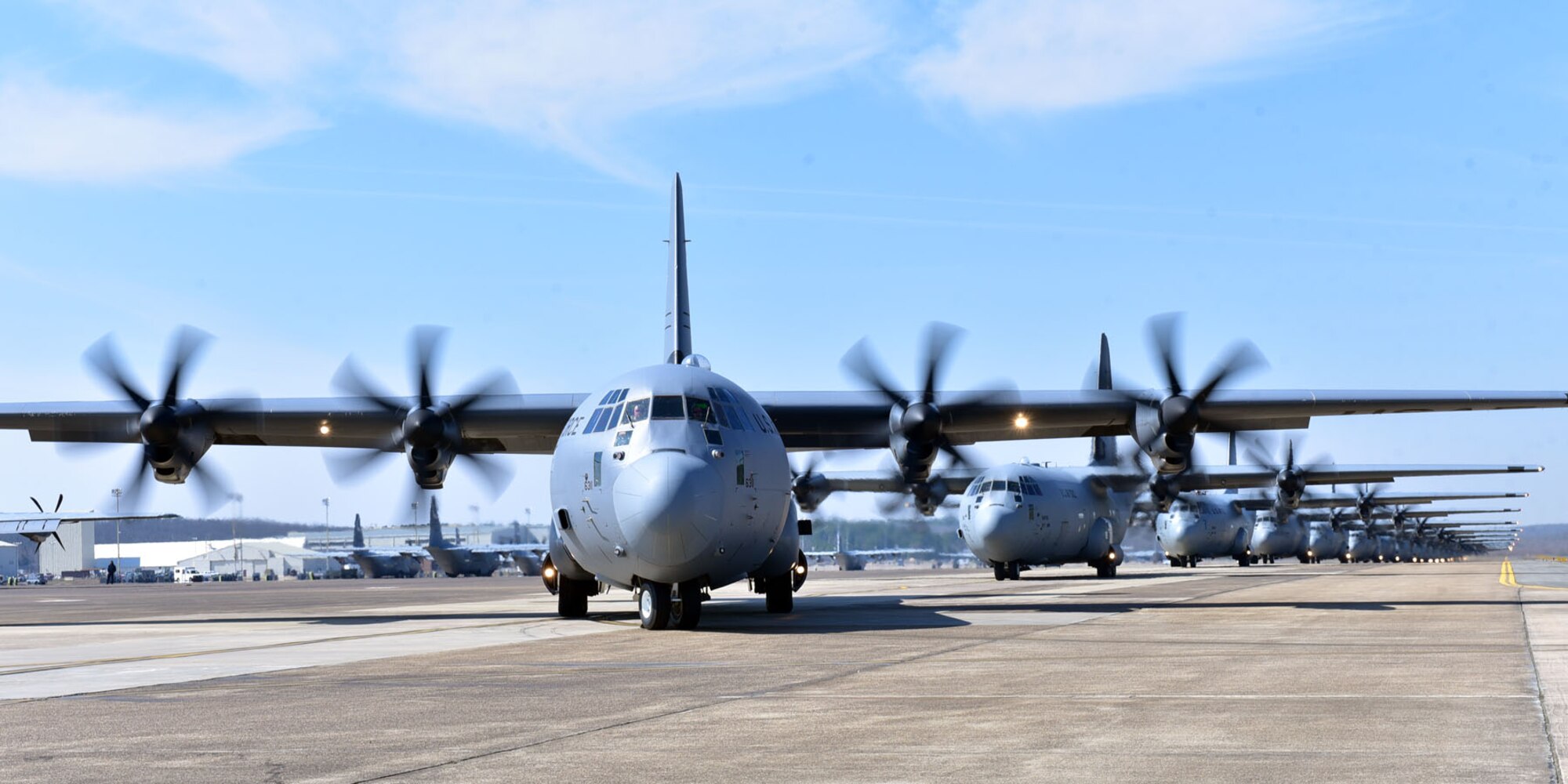 Nineteen C-130J aircraft perform an elephant walk Mar. 15, 2018, at Little Rock Air Force Base, Ark. Five members of the 327th Airlift Squadron, 913th Airlift Group, participated in the 19-aircraft formation, which was designed to enhance skills of pilots and aircrew during large formation operations. (U.S. Air Force photo by Airman 1st Class Rhett Isbell/Released)