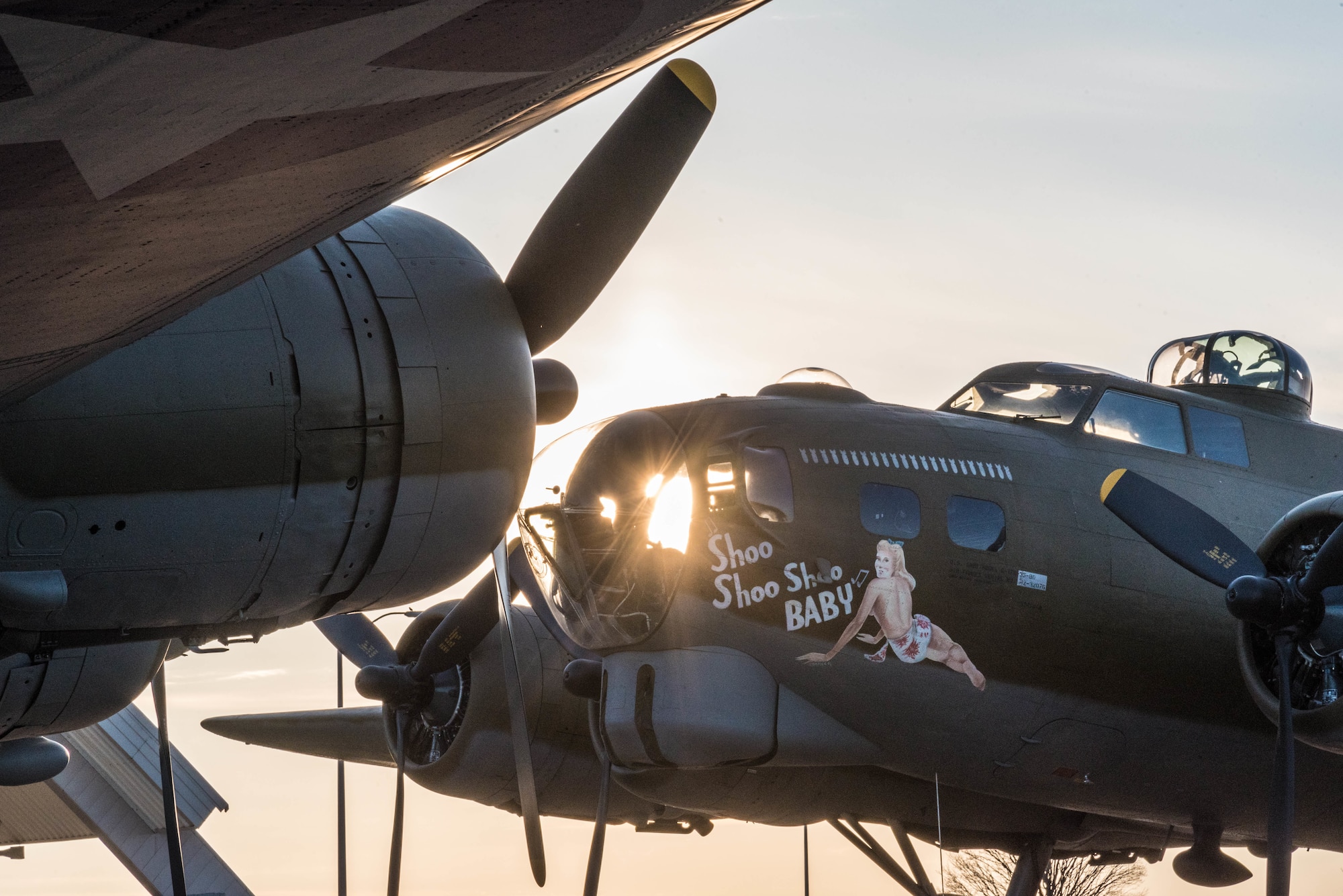 (03/14/2018) -- The B-17F Memphis Belle, left, poses for photos along with the B-17G Shoo Shoo Baby at the National Museum of the United States Air Force on March 14, 2018. Plans call for the aircraft to be placed on permanent public display in the WWII Gallery here at the National Museum of the U.S. Air Force on May 17, 2018. (U.S. Air Force photo by Kevin Lush)