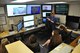 Sam Walker, meteorologist at the Wright-Patterson Air Force Base weather forecasting center demonstrates various technologies and equipment to local high school juniors and seniors that came on to base for the bi-annual Job Shadow Day hosted by the Educational Outreach Office. (U.S. Air Force photo by 2nd Lt. Weston Woodward)