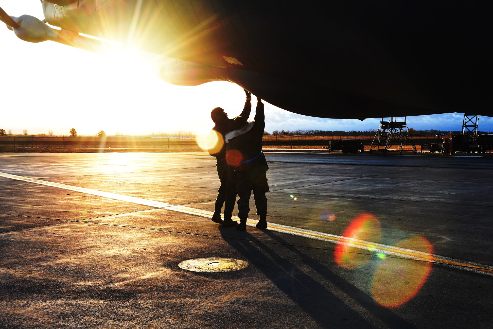 Maj. Jeramie Castellanos, 141st ARW pilot and his crew chief perform a preflight inspection of a KC-135 Stratotanker during exercise Titan Fury at Fairchild Air Force Base, Washington, March 9, 2018. The 92nd and 141st Air Refueling Wings teamed up with the 452nd Air Mobility Wing from March Air Reserve Base to focus on their total force partnerships throughout a week of alert-force operations. (U.S. Air Force photo/ Senior Airman Michala Weller)