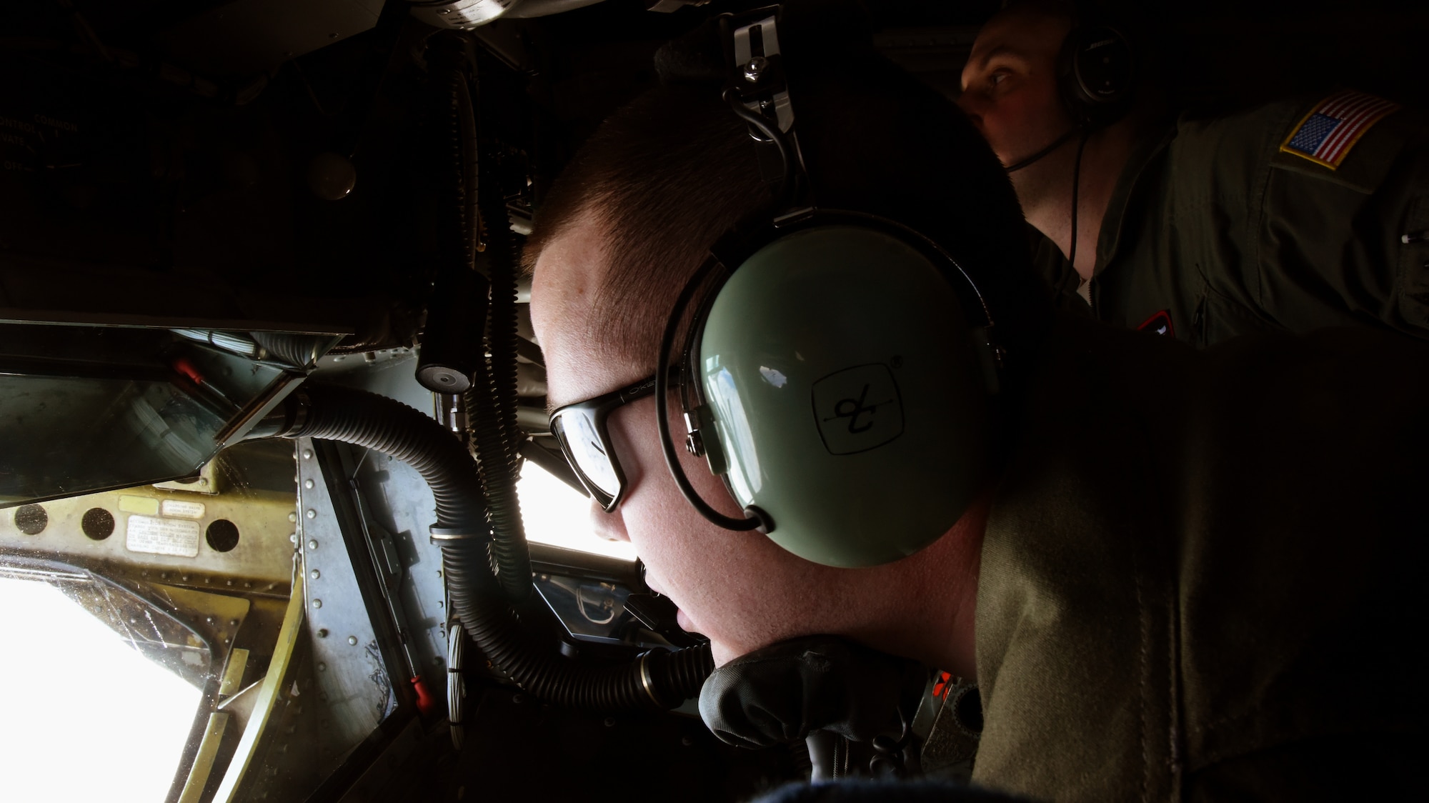 Staff Sgt. Casey McConnell, 92nd Air Refueling Squadron boom operator performs mid-air refueling on a McChord Air Force Base C-17 Globemaster III during exercise Titan Fury at Fairchild Air Force Base, Washington, March 9, 2018. Washington Air National Guard, active duty and reservists all played critical roles during the exercise to enhance interoperability as a total force.  (U.S. Air Force photo/ Senior Airman Michala Weller)