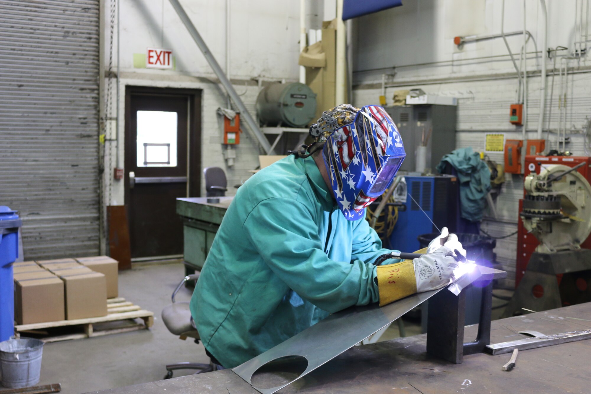 Sheet Metal Worker Andy Riis completes welding in the Model and Machine Shop.