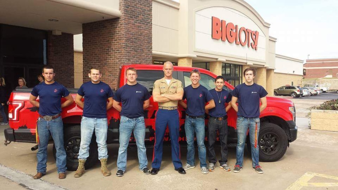 Staff Sgt. Timothy Hucal, a recruiter with Marine Corps Recruiting Station Fort Worth, in Pantego, Texas, poses for a photo with his poolees in Ardmore, Oklahoma, March 16, 2018. Hucal trains Ninja Warrior style at Gauntlet Fitness with his family to relieve stress associated with his recruiting billet and lead a healthy lifestyle.