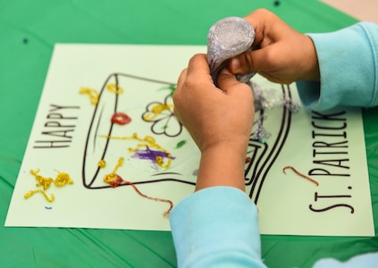 Riley Gomez, daughter of Rachel Gomez, Team Charleston family member, makes arts-and-crafts March 13, 2018, at Joint Base Charleston, S.C.