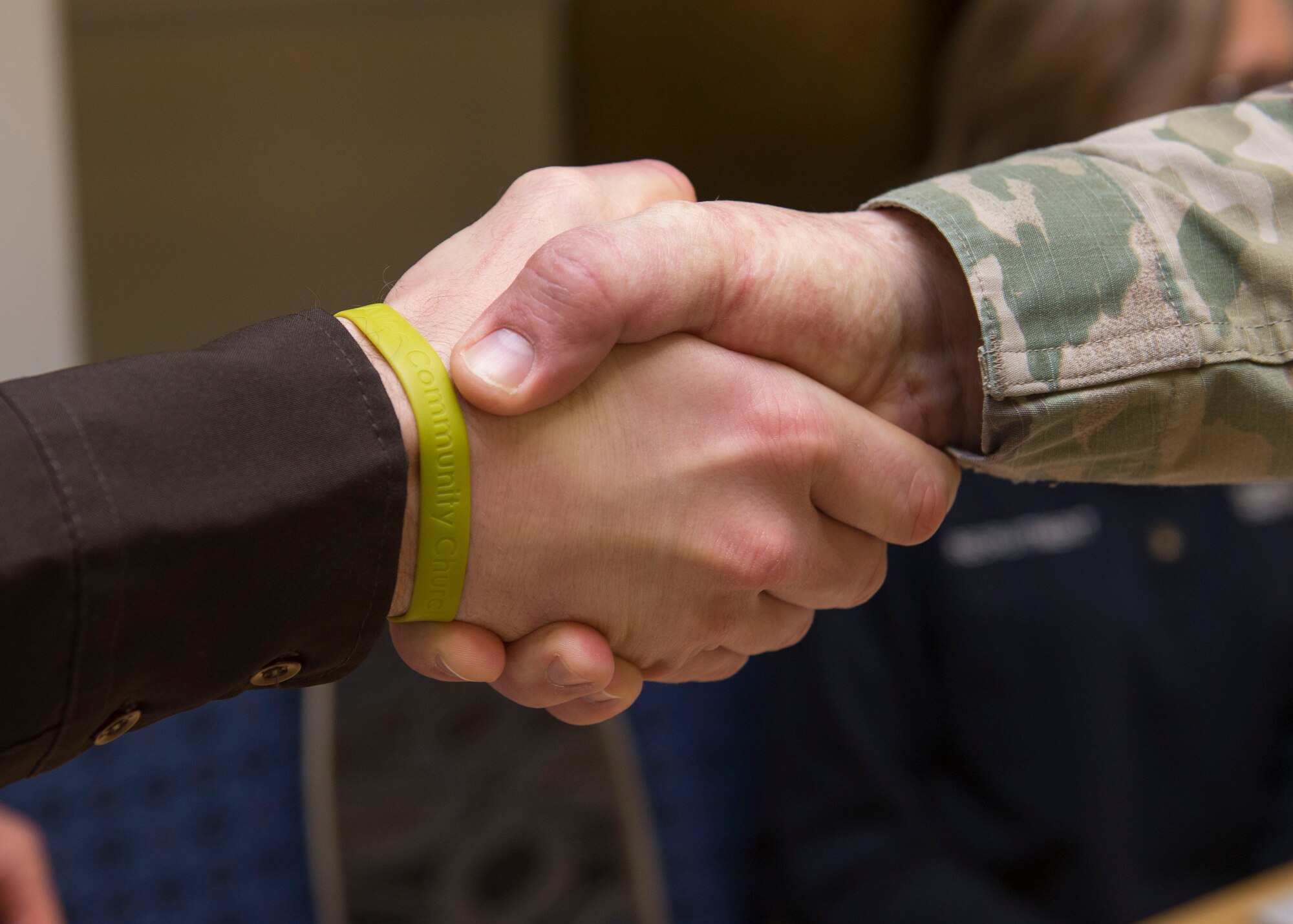 A U.S. Army Soldier shakes hands with a Richmond City Sheriff’s Office representative at the Fort Eustis Club on Joint Base Langley-Eustis, Virginia, March 15, 2018.