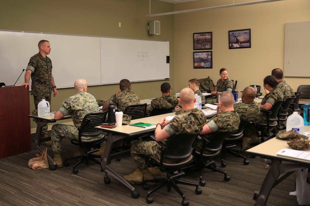 Marines and sailors attending the Operational Stress Control and Readiness train-the-trainer course practice conducting the teach-back portion of their certification, March 14, 2018, at Marine Corps Support Facility New Orleans. In order to become an OSCAR Trainer, the service members have to prove their ability to be able to teach the course and build an OSCAR team. (U.S. Marine Corps photo by Pfc. Samantha Schwoch/released)