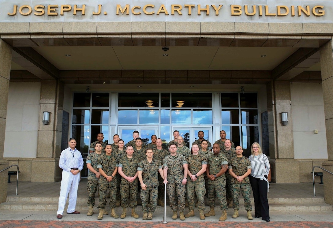 Marines and sailors from Reserve stations across the country pose with their instructors upon completion of the Operational Stress Control and Readiness train-the-trainer course, March 16, 2018, at Marine Corps Support Facility New Orleans. The OSCAR course gives Marines and sailors training on how to identify, support and advise service members with stress reactions, acting as sensors for the commander by noticing small changes in behavior and taking action early. (U.S. Marine Corps photo by Pfc. Samantha Schwoch/released)