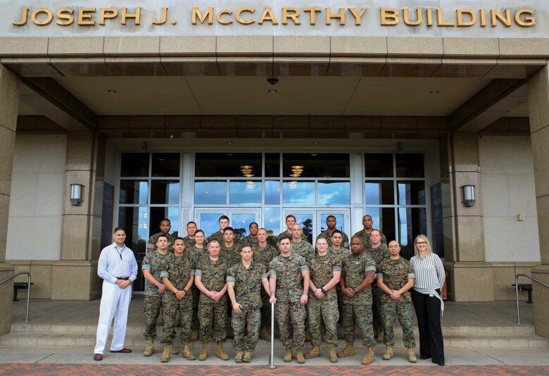 Marines and sailors from Reserve stations across the country pose with their instructors upon completion of the Operational Stress Control and Readiness train-the-trainer course, March 16, 2018, at Marine Corps Support Facility New Orleans. The OSCAR course gives Marines and sailors training on how to identify, support and advise service members with stress reactions, acting as sensors for the commander by noticing small changes in behavior and taking action early. (U.S. Marine Corps photo by Pfc. Samantha Schwoch/released)