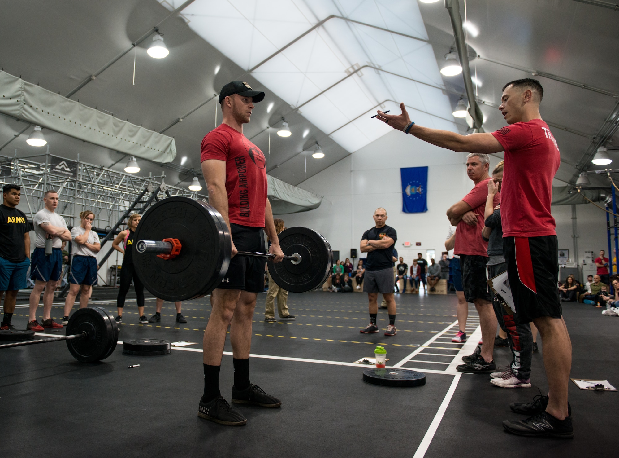 Senior Airman Taylor Keller, 56th Equipment Maintenance Squadron aerospace ground equipment technician, performs a deadlift to demonstrate proper form during the 2018 Reebok CrossFit Games Open 18.4 at Luke Air Force Base, Ariz., March 15, 2018. The open is the first stage of the CrossFit Games season and the largest community CrossFit event of the year. (U.S. Air Force photo by Airman 1st Class Alexander Cook)