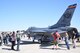 Onlookers gather to observe the F-16 Fighting Falcon from Tucson, Arizona and talk to readily available pilots, to learn more about the lethality and aerodynamic capabilities of the aircraft here, during the Luke Days Air Show, March 17, 2018. The wing has trained pilots from 25 countries that fly the F-16 today while developing strategic partnerships and building strong international relationships based on performance, friendship, and trust. (U.S. Air National Guard photo by 1st Lt. Tinashe Machona)