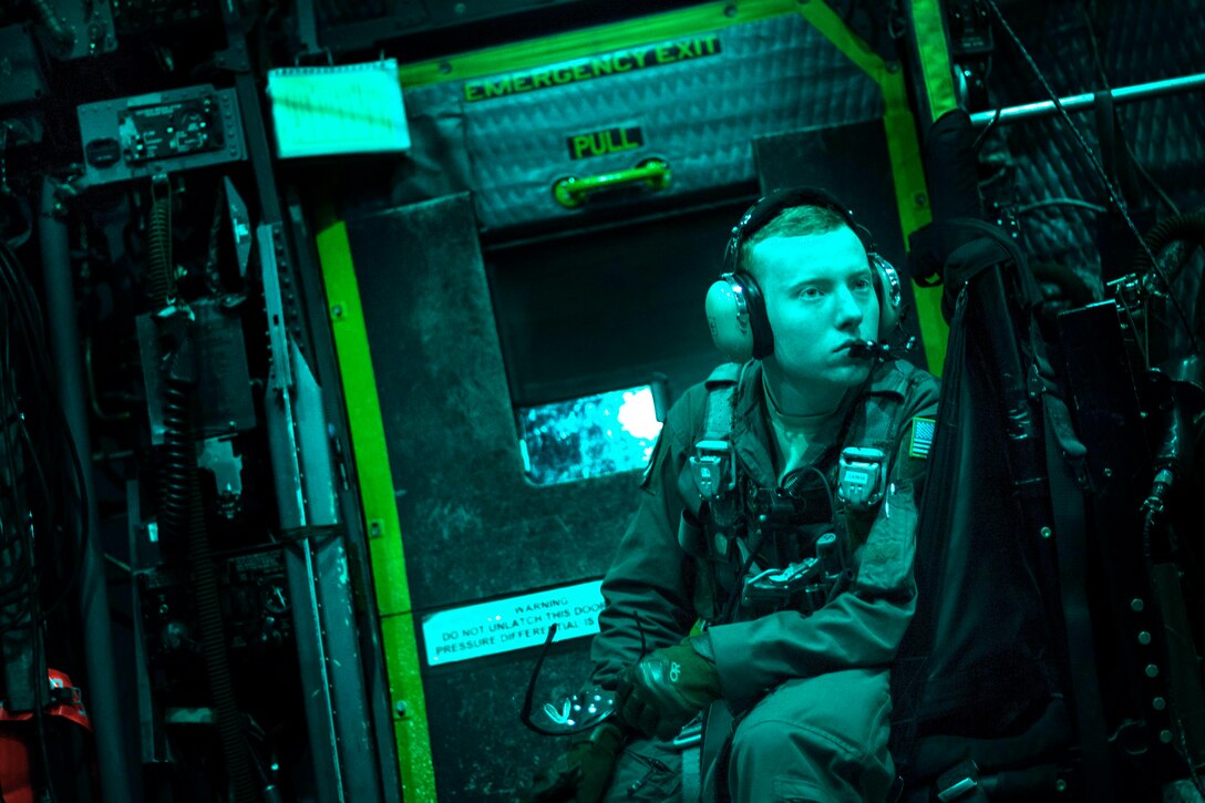 An airman waits to refuel an aircraft.