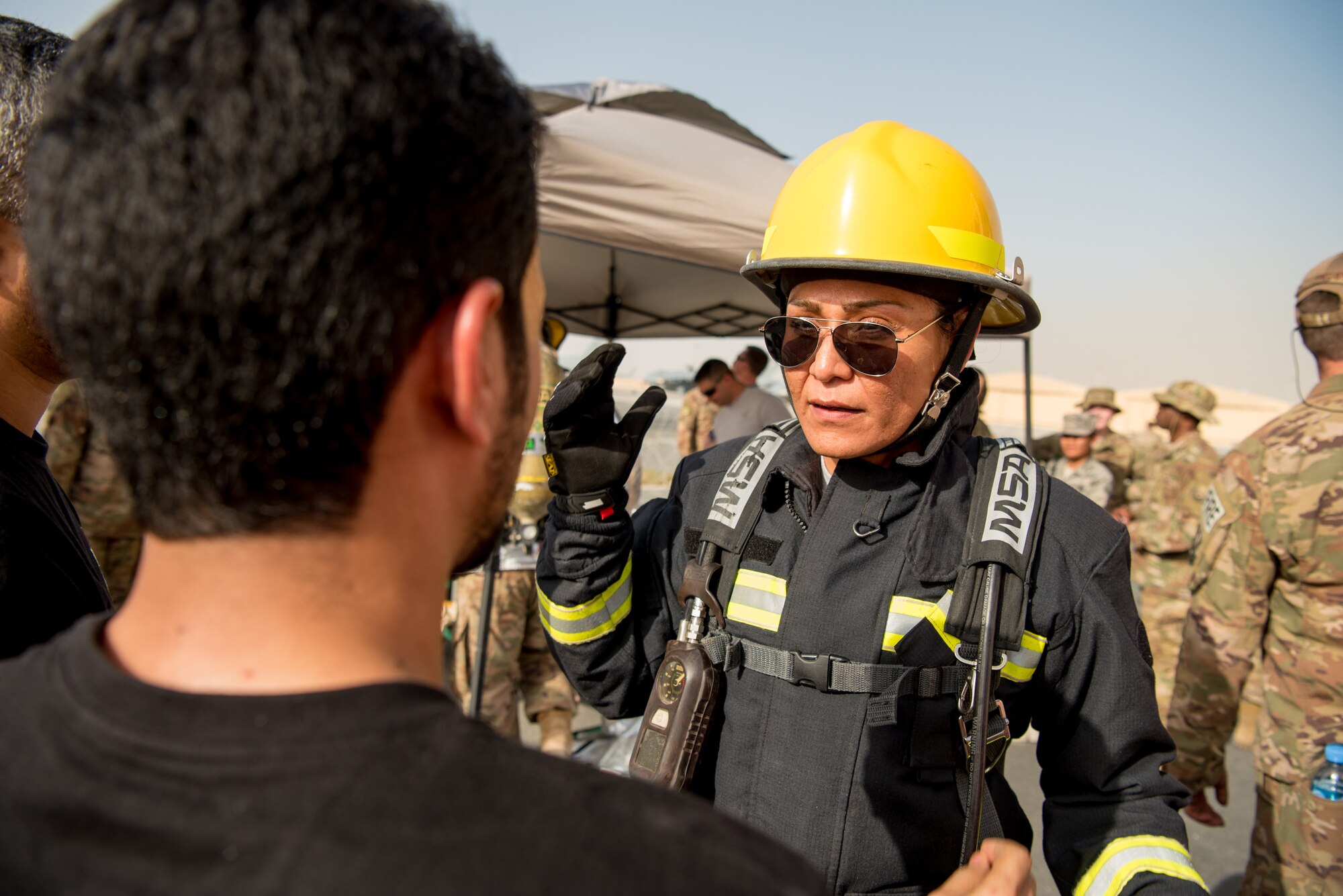 Senior Master Sgt. Mireya Calderafavela, force protection superintendent from the 379th Expeditionary Civil Engineer Squadron, prepares to participate in a firefighter challenge exercise at Al Udeid Air Base, Qatar, March 8, 2018. The a exercise, a strenuous course designed to test physical fitness and fire response capabilities, was organized by firefighters from the 379th ECES and Qatar Emiri Air Force. (U.S. Air Force photo by Staff Sgt. Joshua Horton)