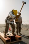 Members of the 379th Air Expeditionary Wing and Qatar Emiri Air Force participate in a firefighter challenge exercise at Al Udeid Air Base, Qatar, March 8, 2018. The a exercise, a strenuous course designed to test physical fitness and fire response capabilities, was organized by firefighters from the 379th ECES and Qatar Emiri Air Force. (U.S. Air Force photo by Staff Sgt. Joshua Horton)