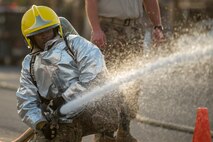 Members of the 379th Air Expeditionary Wing and Qatar Emiri Air Force participate in a firefighter challenge exercise at Al Udeid Air Base, Qatar, March 8, 2018. The a exercise, a strenuous course designed to test physical fitness and fire response capabilities, was organized by firefighters from the 379th ECES and Qatar Emiri Air Force. (U.S. Air Force photo by Staff Sgt. Joshua Horton)