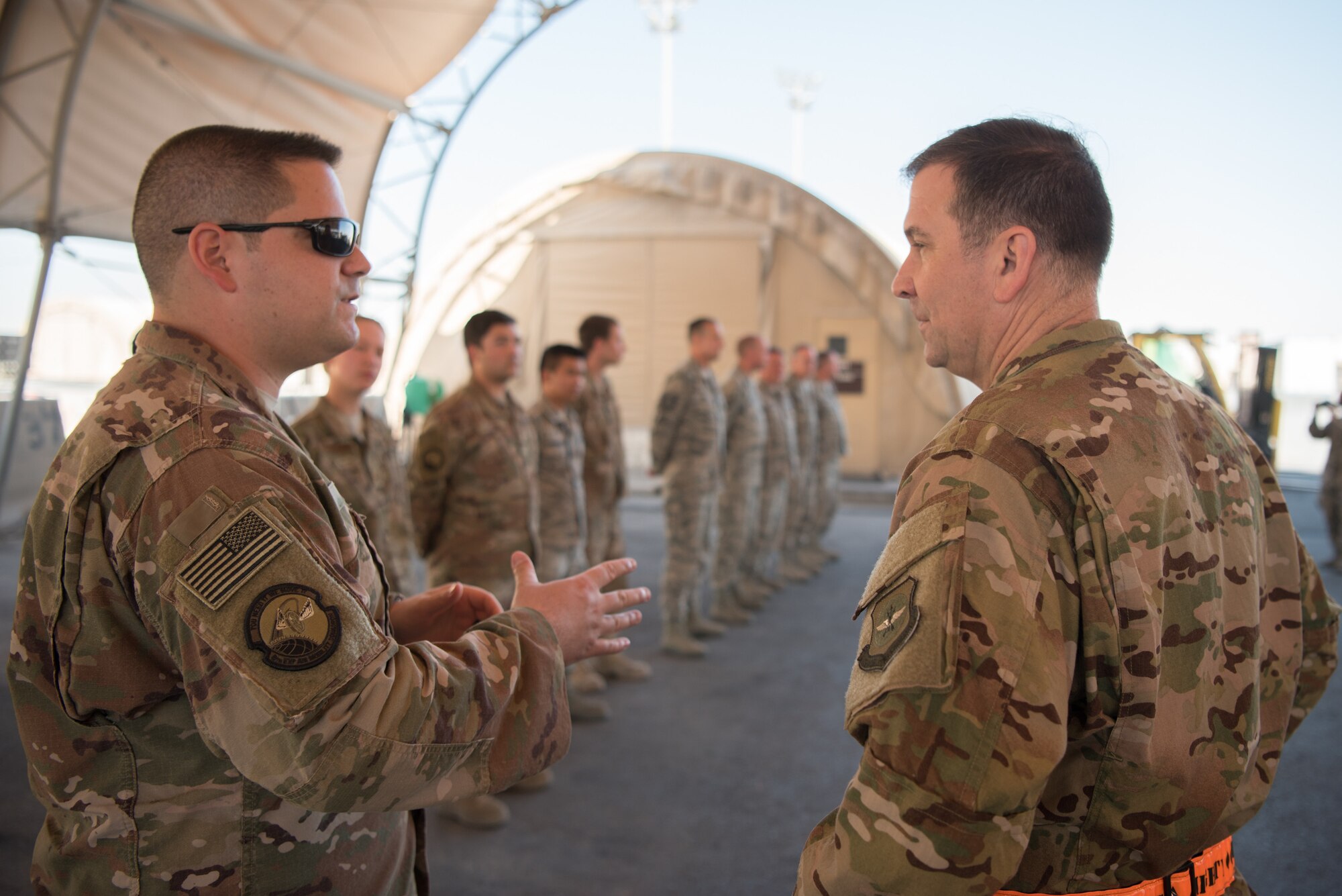 Maj. Gen. Christopher J. Bence, commander of the U.S. Air Force Expeditionary Center, tours the facilities of the 8th Expeditionary Air Mobility Squadron at Al Udeid Air Base, Qatar, March 4, 2018. The visit, part of a nine-day tour of various components of the 521st Air Mobility Operations Wing, provided Bence an opportunity to see the day-to-day operations of the 8 EAMS, observe how they complete their mission, and commemorate a few selected Airmen for their outstanding performance. (U.S. Air Force photo by Staff Sgt. Joshua Horton)