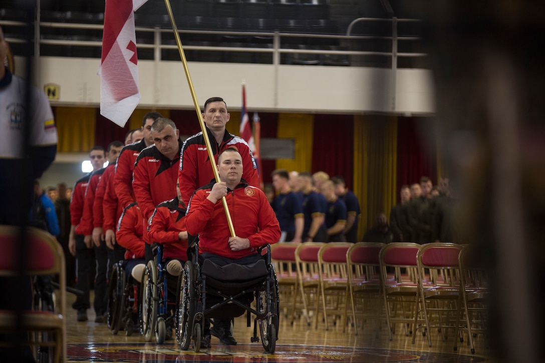 Team Georgia moves to center stage during the 2018 Marine Corps Trials opening ceremony on Marine Corps Base Camp Lejeune, N.C., March 17, 2018. The Marine Corps Trials promotes recovery and rehabilitation through adaptive sport participation and develops camaraderie among recovering service members and veterans. It is as an opportunity for RSMs to demonstrate their achievements and serves as the primary venue to select Marine Corps participants for the DoD Warrior Games.