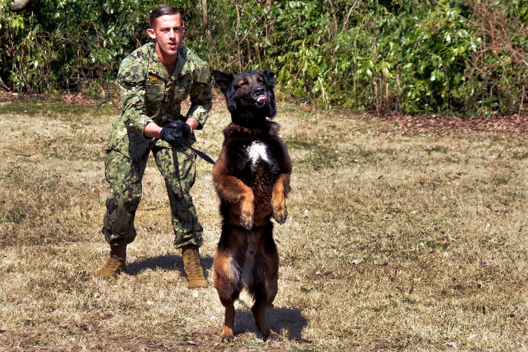 A sailor prepares to release Atom.