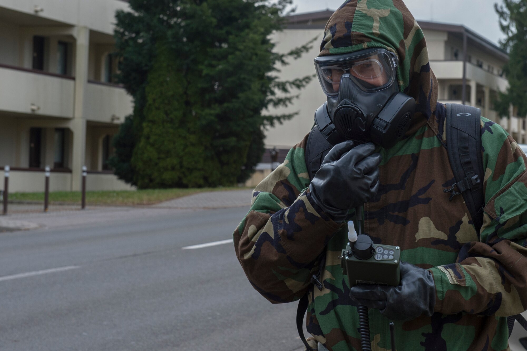 U.S. Air Force Tech. Sgt. Timothy Bennett, 52nd Civil Engineer Squadron post-attack reconnaissance team lead, radios to the chemical, biological, radiological and nuclear defense control center during PAR sweep at Spangdahlem Air Base, Germany, March 15, 2018. CBRN defense protective measures are taken in situations where CBRN warfare hazards may be present. (U.S. Air Force photo by Senior Airman Dawn M. Weber)