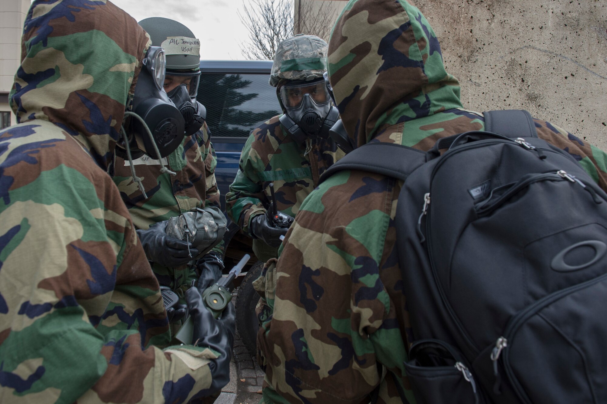 A post-attack reconnaissance team prepares to test simulated air contaminates after a mock explosion at Spangdahlem Air Base, Germany, March 15, 2018. The team completed a PAR sweep of a simulated chemical, biological, radiological, nuclear attack area during a base-wide exercise to test combat readiness. (U.S. Air Force photo by Senior Airman Dawn M. Weber)