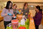 Members of the DLA Troop Support’s Medical Culture Improvement Team hand out water ice during a pep rally at DLA Troop Support in Philadelphia, March 14, 2018.