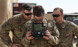 1st Security Forces Assistance Brigade (SFAB) Soldiers from Fort Benning, Ga. learn how to use the Instant Eye technology while their drone is in flight, Mar. 6, 2018. The Instant Eye allows the Soldier to see what the drone camera is capturing as well as control the drones movement and flight path.