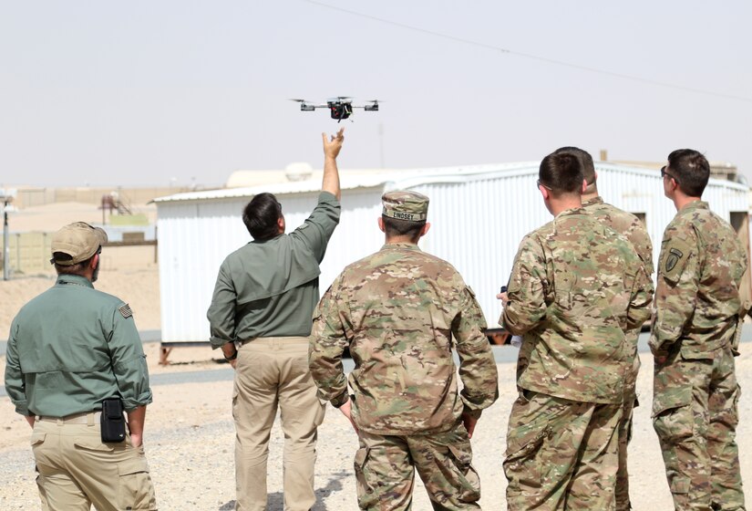 Instructors from ARCENT Readiness Training Center - Kuwait (ARTC-KU) demonstrate how to launch a drone using Instant Eye technology for 1st Security Forces Assistance Brigade (SFAB) Soldiers, Mar. 6, 2018. The 1st SFAB recently deployed from Fort Benning, Ga. and will proceed to their final destination in Afghanistan.