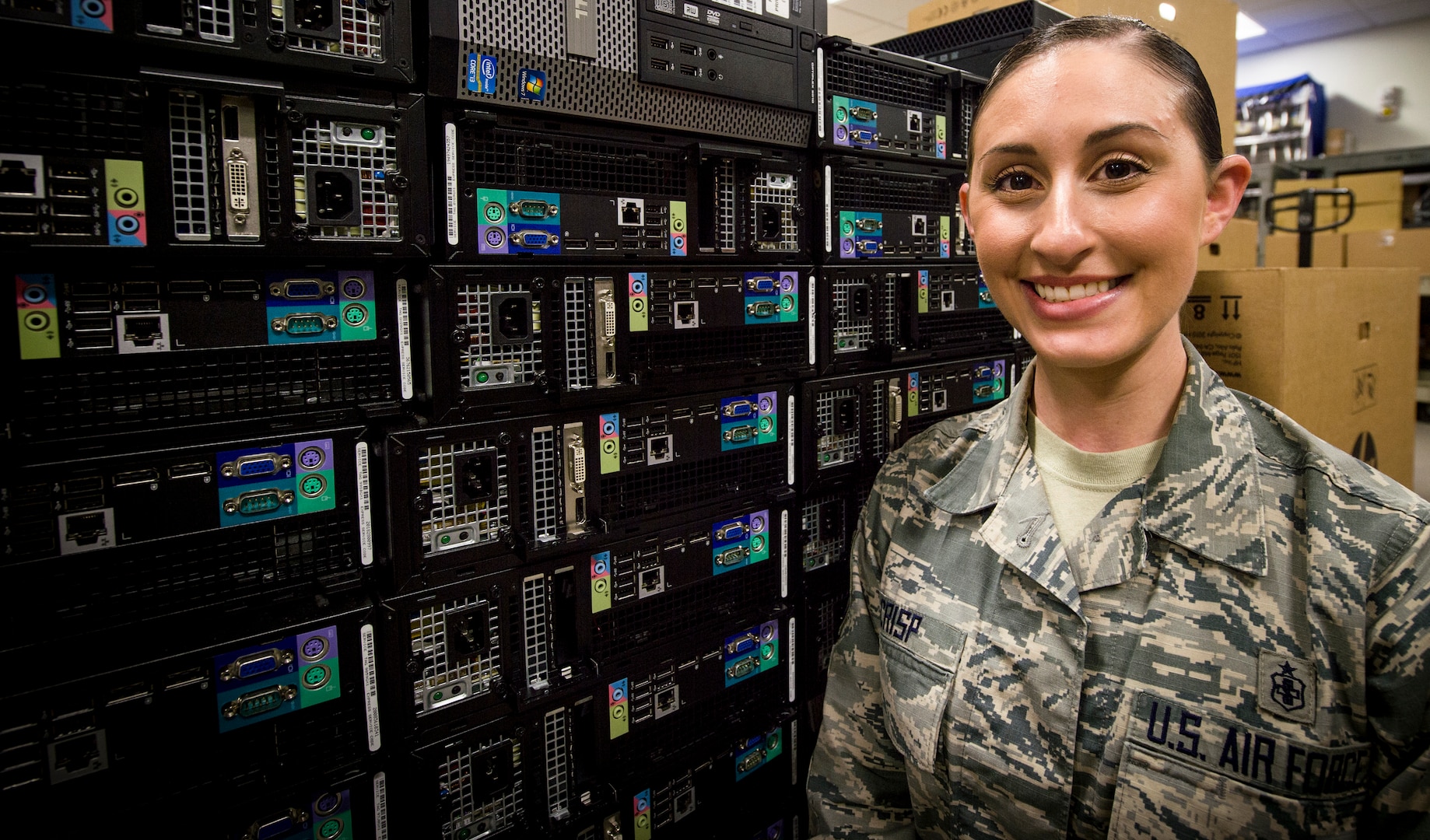 Staff Sgt. Kayce Crisp, an informatinon systems technician from the 59th Medical Wing, explains the process of upgrading a computer's operating system March 13, 2018 at Joint Base San Antonio-Lackland. The 59th MDW information technician staff upgraded a record amount of more than 3,700 systems to maintain Air Force standards.