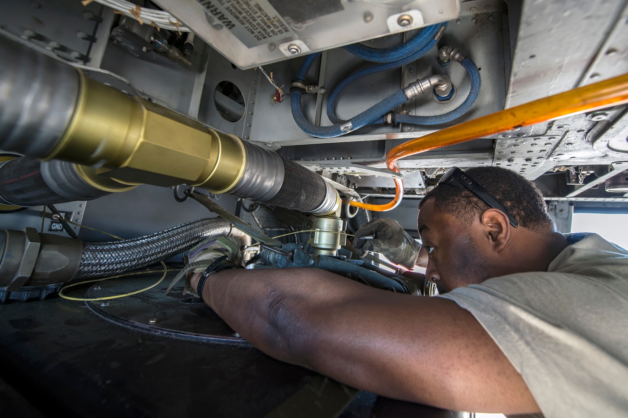 Senior Airman Latrell Solomon, 41st Rescue Squadron (RQS) special missions aviator, gauges the fuel tank of an HH-60G Pave Hawk, March 15, 2018, at Moody Air Force Base, Ga. Airmen from the 41st RQS and 723d Aircraft Maintenance Squadron conducted pre-flight checks to ensure that an HH-60G Pave Hawk was fully prepared for a simulated combat search and rescue mission. (U.S. Air Force photo by Airman Eugene Oliver)