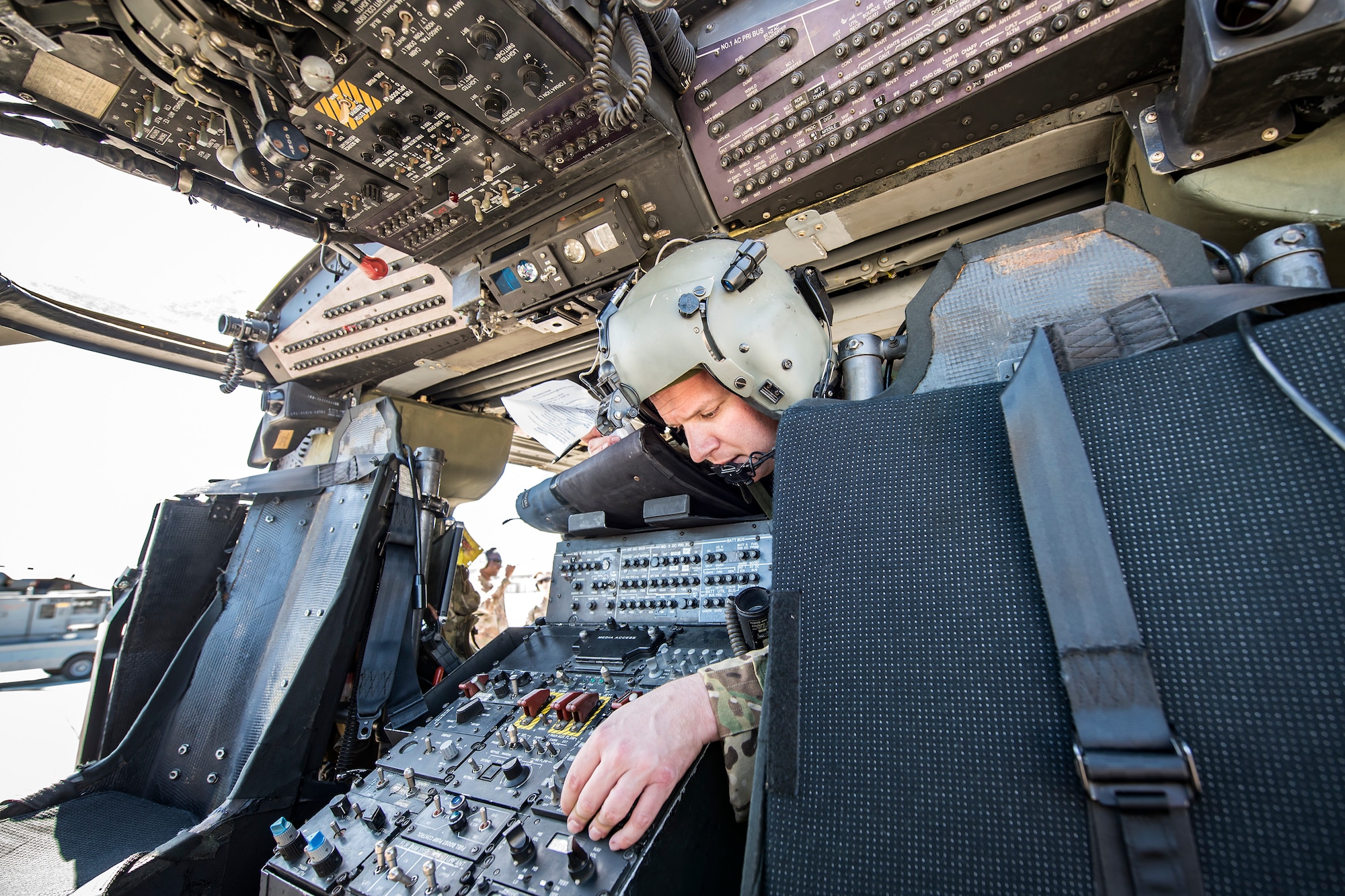 Tech. Sgt. Justin Cole, 41st Rescue Squadron (RQS) special missions aviator, performs an operations check, March 15, 2018, at Moody Air Force Base, Ga. Airmen from the 41st RQS and 723d Aircraft Maintenance Squadron conducted pre-flight checks to ensure that an HH-60G Pave Hawk was fully prepared for a simulated combat search and rescue mission. (U.S. Air Force photo by Airman Eugene Oliver)