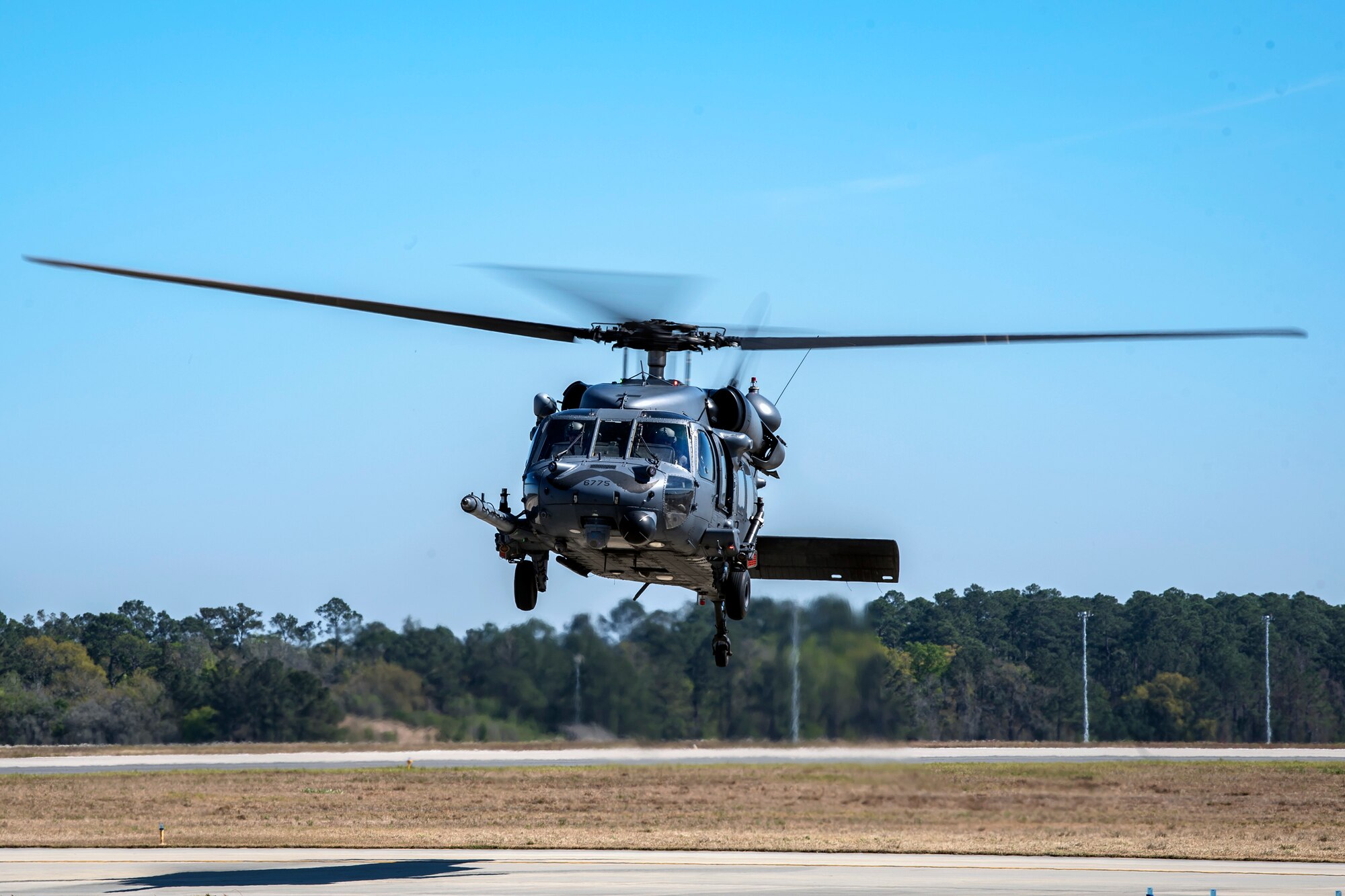 An HH-60G Pave Hawk hovers over the flight line, March 15, 2018, at Moody Air Force Base, Ga. Airmen from the 41st RQS and 723d Aircraft Maintenance Squadron conducted pre-flight checks to ensure that an HH-60G Pave Hawk was fully prepared for a simulated combat search and rescue mission. (U.S. Air Force photo by Airman Eugene Oliver)