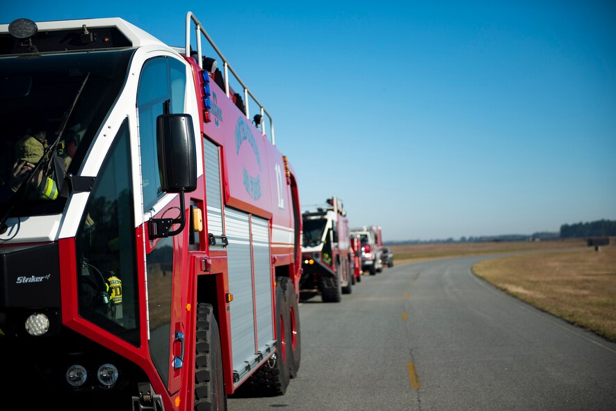 Aircraft rescue firefighting vehicles from the 23d Civil Engineer Squadron (CES) sit on the road prior to a live-fire burn exercise, March 15, 2018, at Moody Air Force Base, Ga. Firefighters from the 23d CES conducted the exercise to demonstrate aircraft rescue firefighting capabilities to community leaders and Moody’s honorary commanders. (U.S. Air Force photo by Airman 1st Class Erick Requadt)