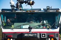 Senior Airman Jeffrey Young, right, Airman 1st Class Orlando Chapman and Thomas Fawcett, 23d Civil Engineer Squadron (CES) firefighters, wait in an aircraft rescue firefighting vehicle prior to a live-fire burn exercise, March 15, 2018, at Moody Air Force Base, Ga. Firefighters from the 23d CES conducted the exercise to demonstrate aircraft rescue firefighting capabilities to community leaders and Moody’s honorary commanders. (U.S. Air Force photo by Airman 1st Class Erick Requadt)