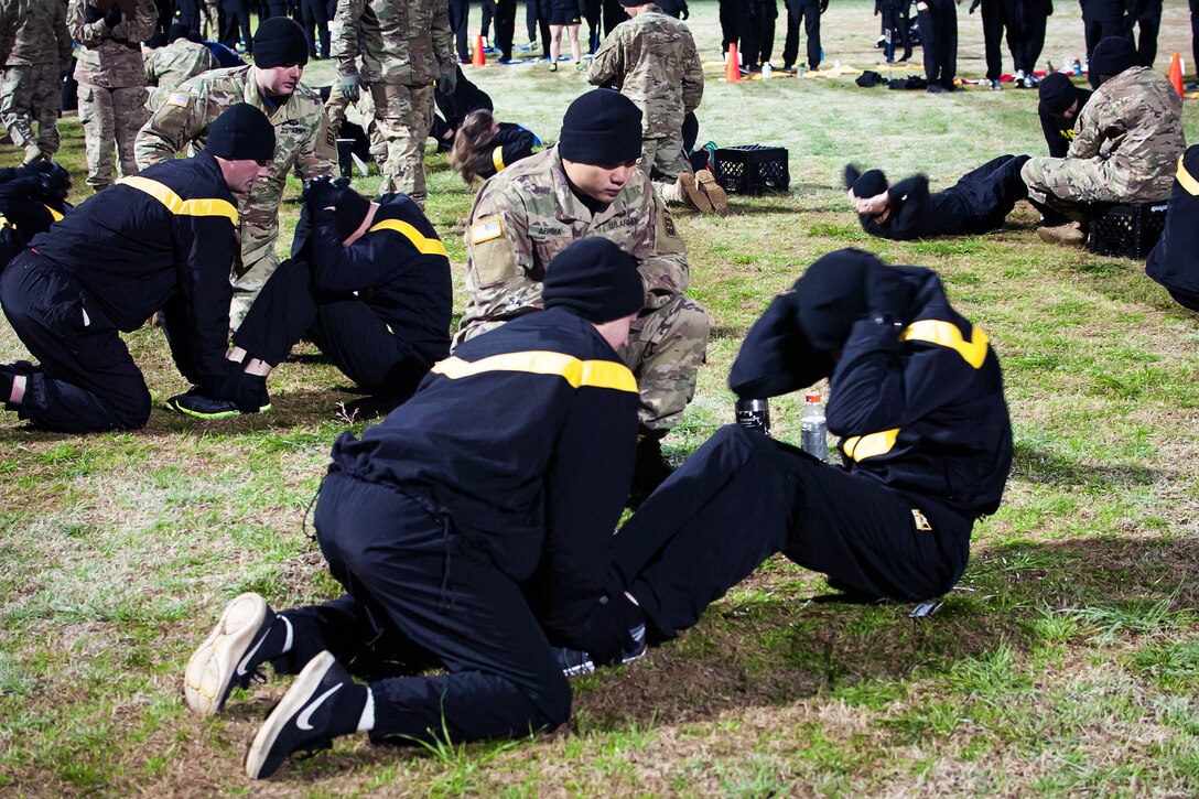 Soldiers perform the situps.