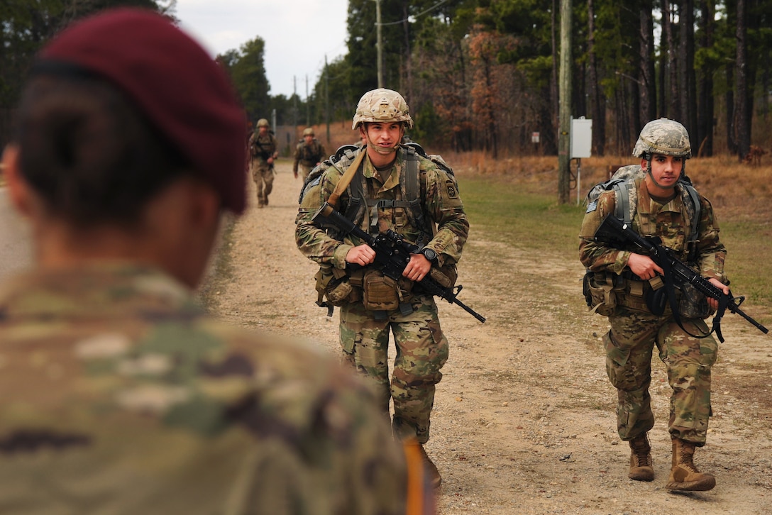 Soldiers finish a timed ruck march.