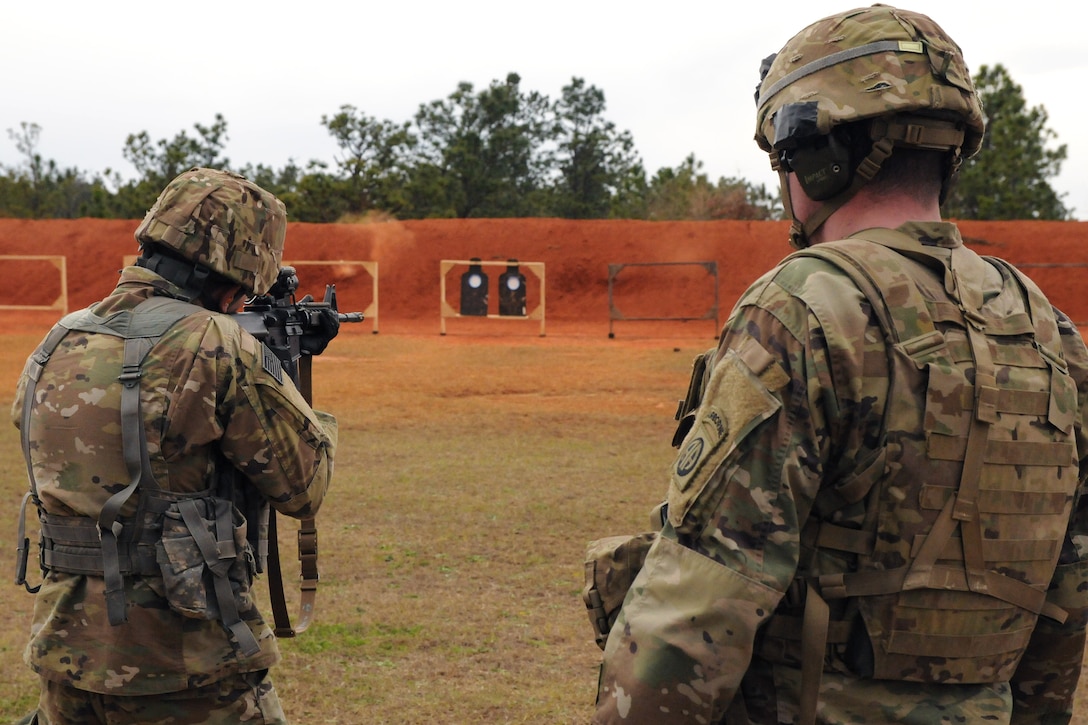 A soldier fires his weapon.