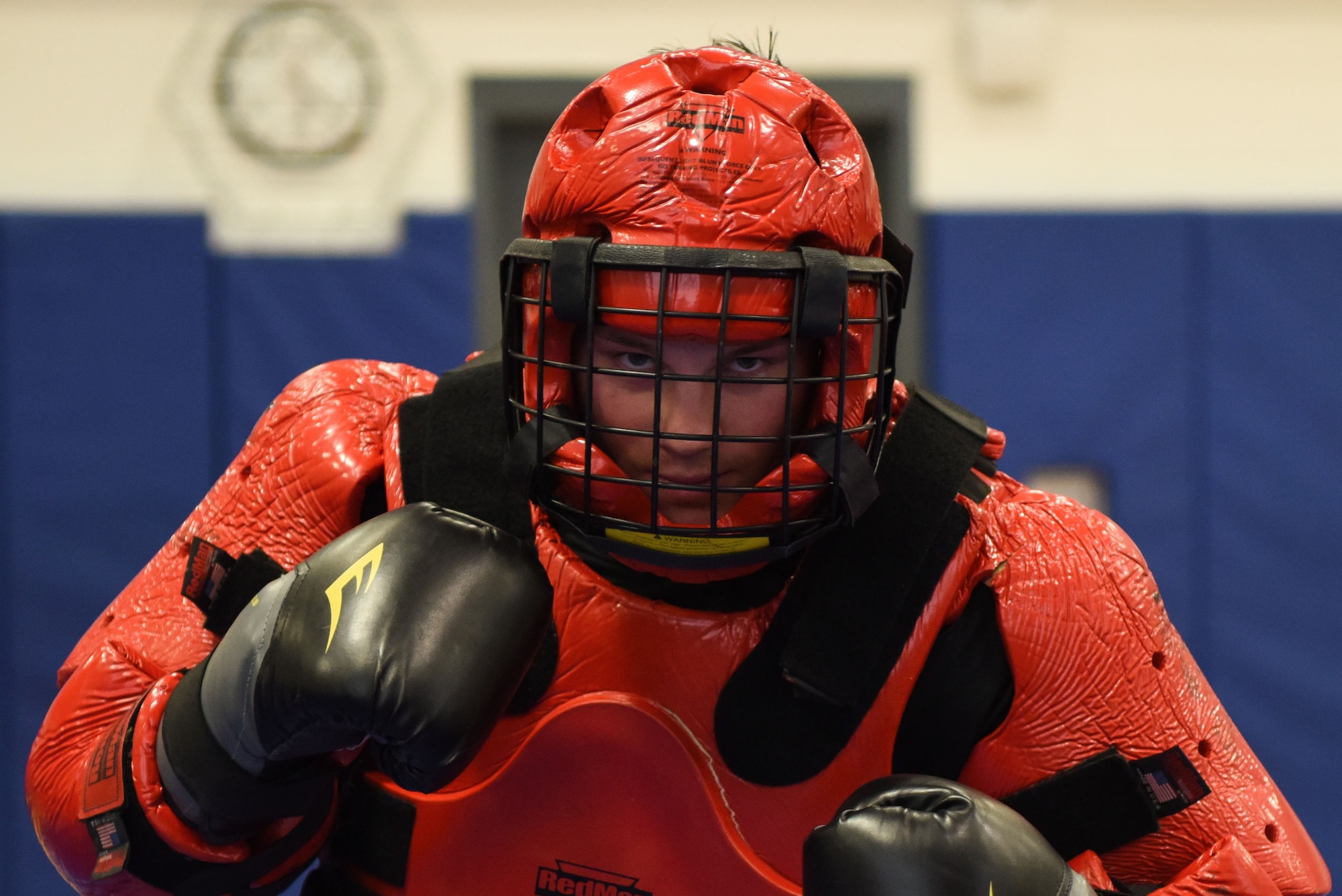 Staff Sgt. Michael Rice, 436th Security Forces Squadron Raven, wears the “Red Man” suit during a demonstration March 8, 2018, at Central Middle School in Dover, Del. Rice served as the aggressor in the sparing sessions while his opponents used batons to defend themselves.  (U.S. Air Force Photo by Airman 1st Class Zoe M. Wockenfuss)