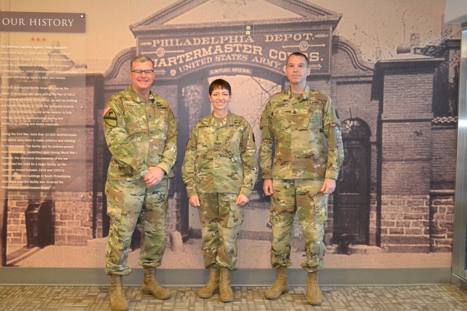 From left, Army Brig. Gen. Mark Simerly, DLA Troop Support commander, Maj. Gen. Barbara Holcomb, U.S. Army Medical Research and Material Command commanding general, and Command Sgt. Maj. David Rogers pose for a picture at DLA Troop Support, March 16, 2018 in Philadelphia.